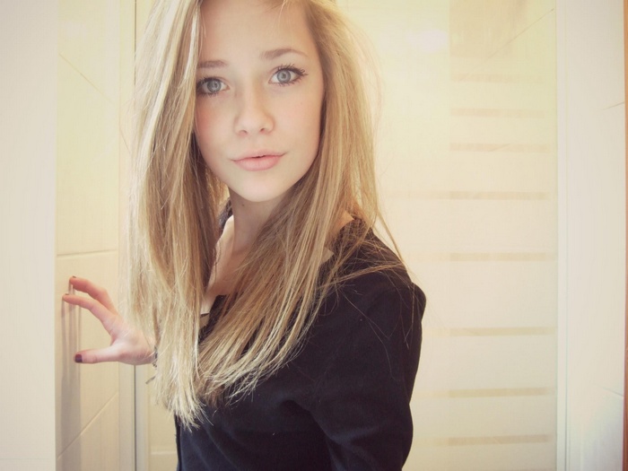 Young blonde woman with blue eyes and long hair
