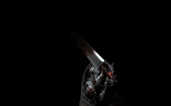 Guts from Berserk holding a bloody sword