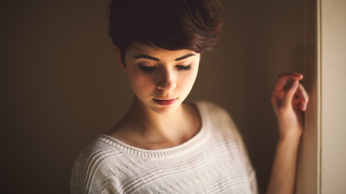 Portrait of a young woman with short brown hair