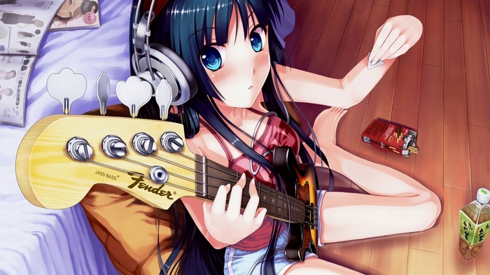 Akiyama Mio playing a Fender bass guitar
