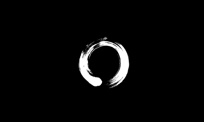 Ensō circle brush stroke on black background