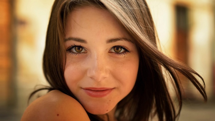 Dana Kareglazaya smiling with bare shoulders