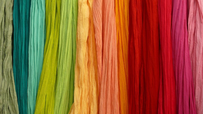 Colorful pleated fabrics in a rainbow of colors
