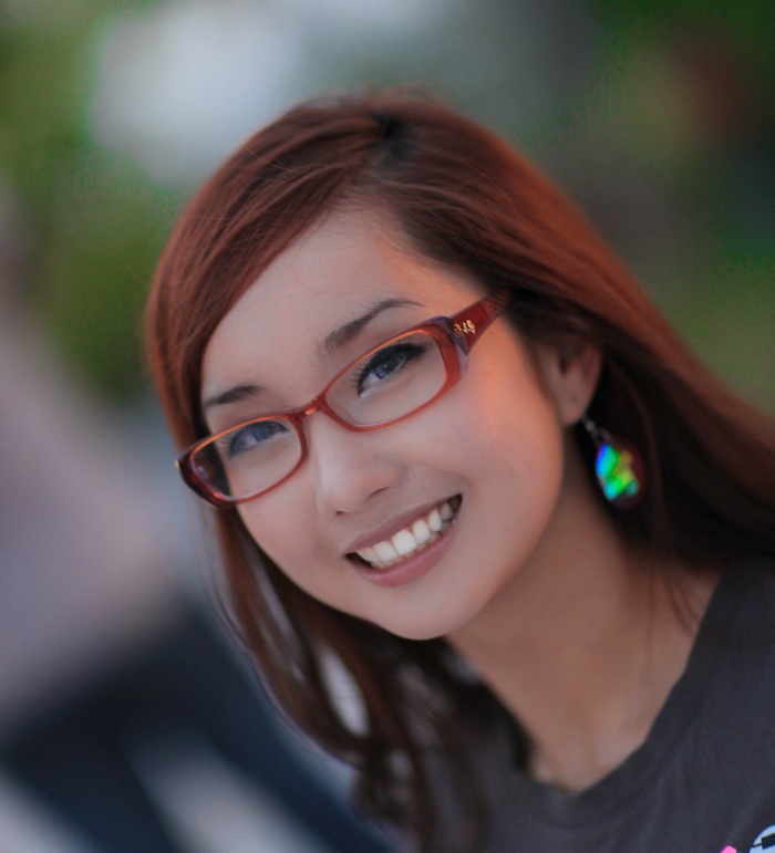 Alodia Gosiengfiao wearing glasses and smiling