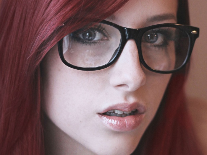 Sofia Wilhelmina wearing glasses, close-up portrait