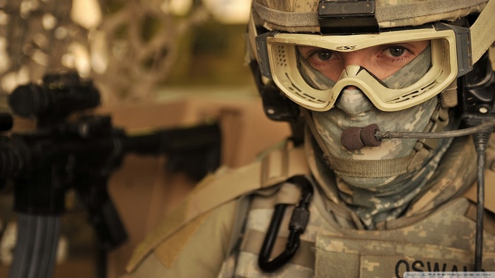 Soldier wearing tactical gear and holding a rifle