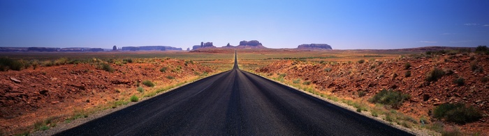 Highway through Monument Valley desert landscape