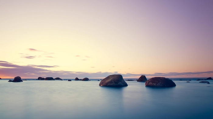Rocks in the sea at sunset