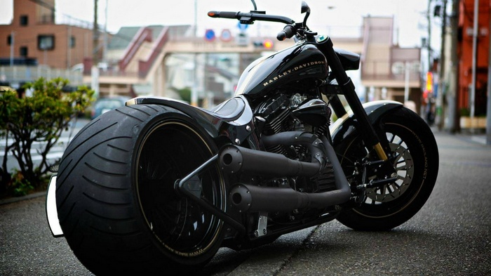 Black Harley-Davidson motorcycle parked on a street