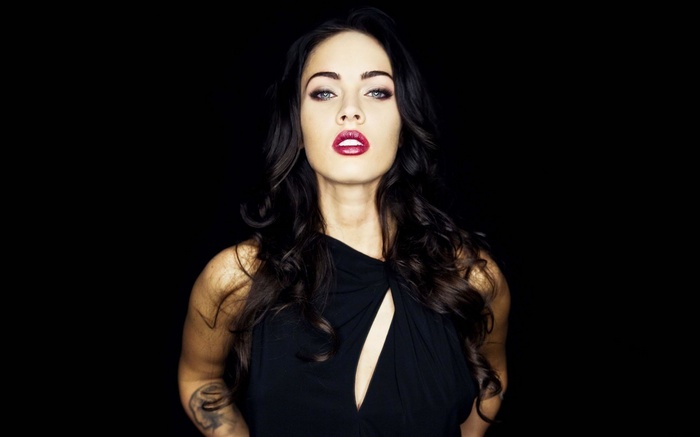 Megan Fox with red lipstick and black dress