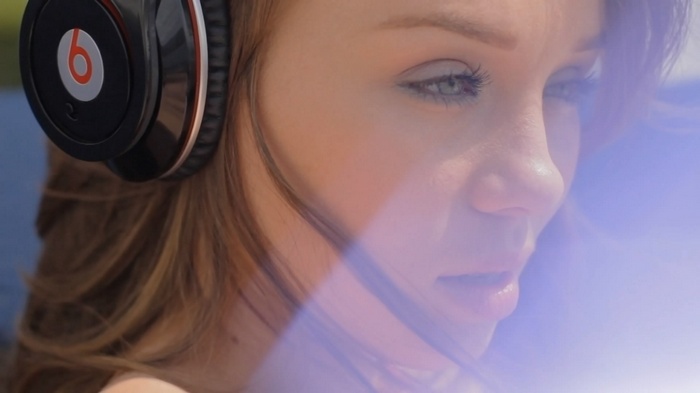 Capri Anderson wearing Beats headphones