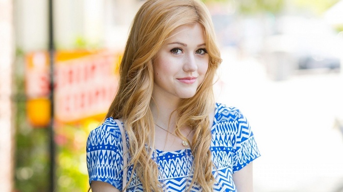 Katherine McNamara smiling outdoors