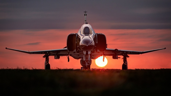 F-4 Phantom II jet fighter at sunset