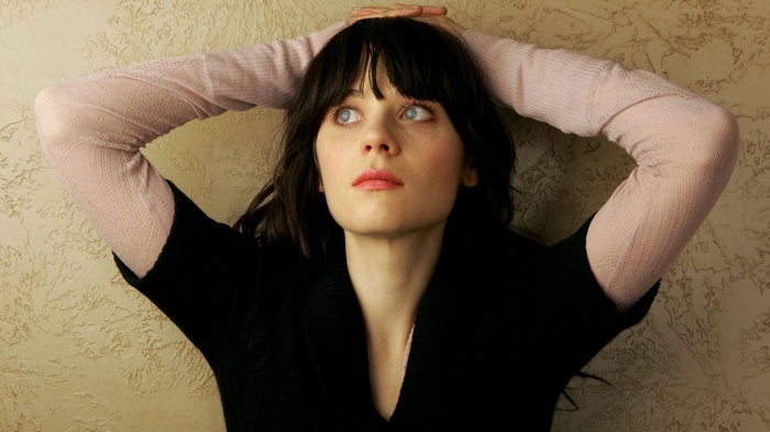 Zooey Deschanel with arms up