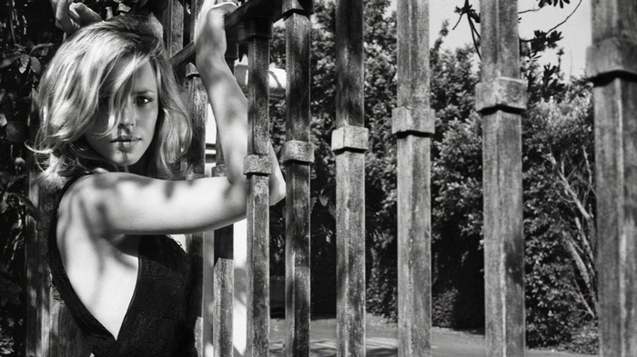 Rachel McAdams leaning on a fence