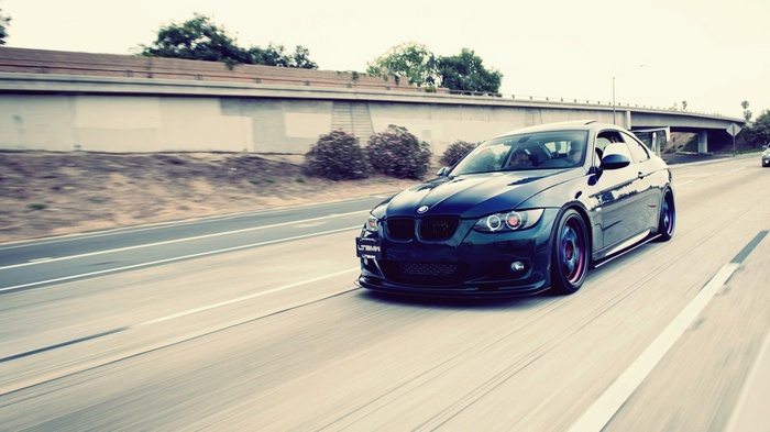 Dark Blue BMW Coupe Driving on Highway