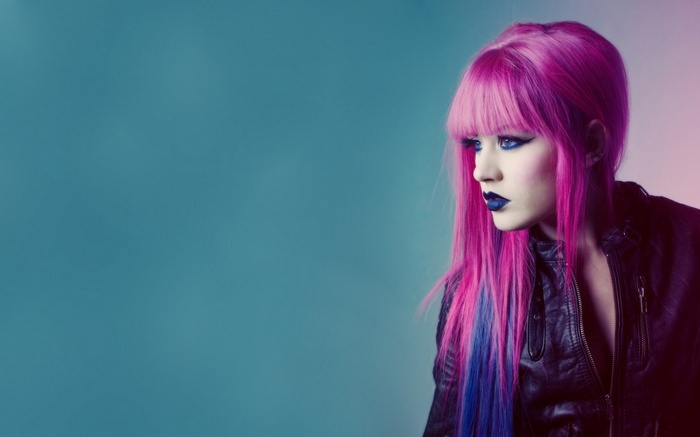 Woman with pink and blue hair and dark makeup