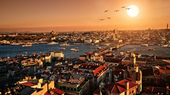 Istanbul cityscape with Galata Bridge at sunset