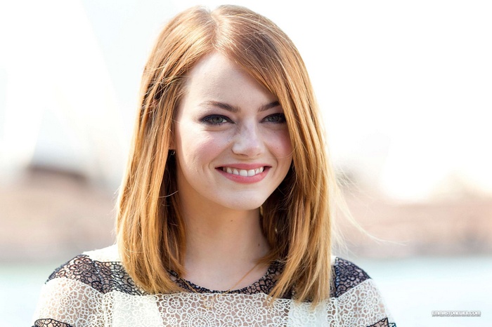 Emma Stone smiling outdoors