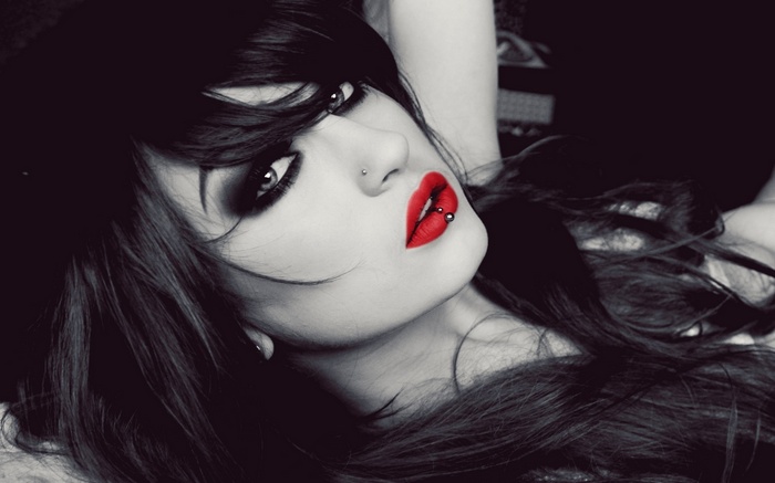 Niky Von Macabre with red lipstick and piercings