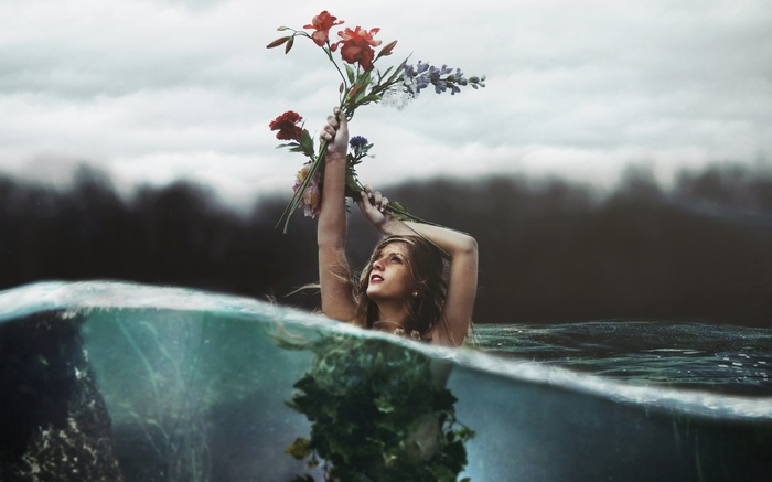Woman holding flowers in water with split view