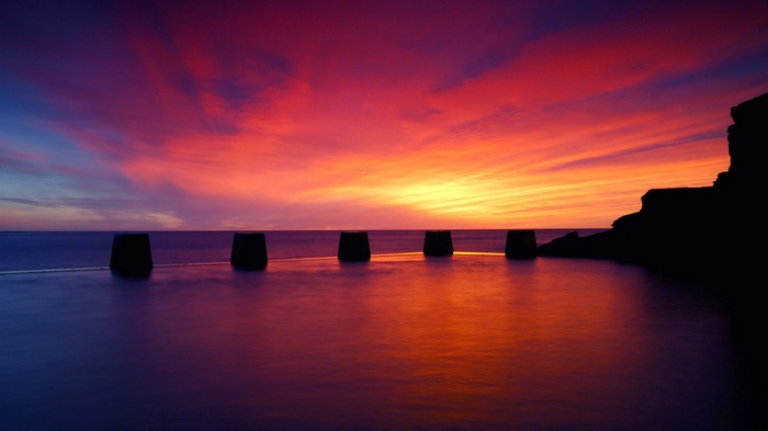 Sunset over the sea with rock formations