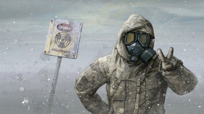 Person in gas mask near radiation warning sign