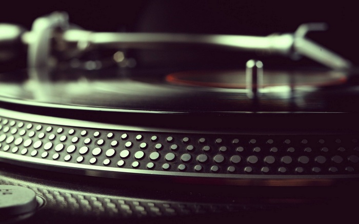 Close-up of a turntable with a spinning vinyl record