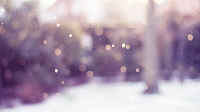 Blurred winter scene with bokeh and snow