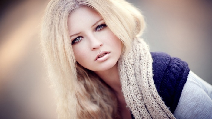 Portrait of a blonde woman with a scarf