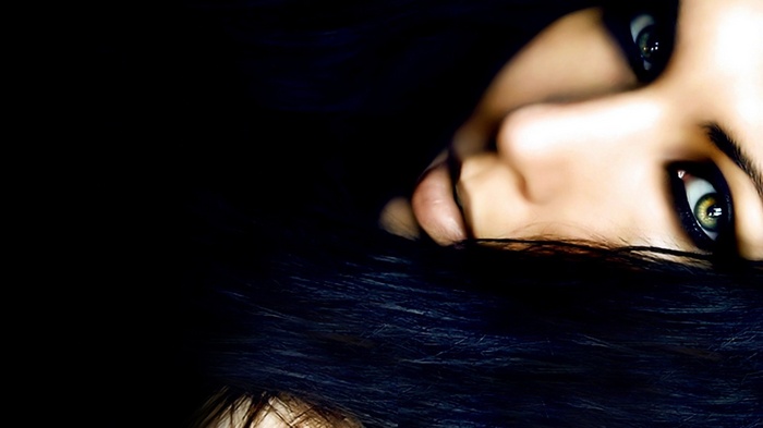 Close-up of a woman's face with dark hair