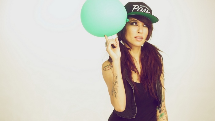 Alie Layus with a balloon on her finger