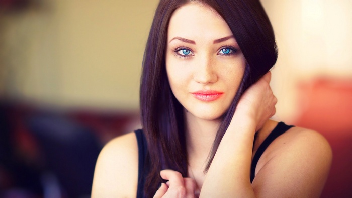 Brunette woman with striking blue eyes