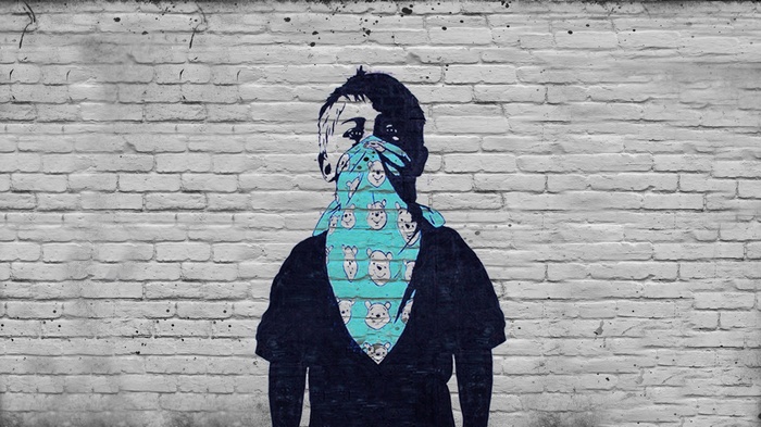 Graffiti of a child with a Winnie the Pooh bandana