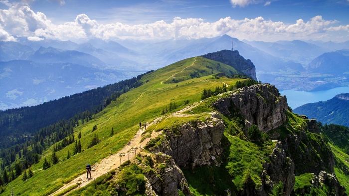 Rigi mountain ridge with hikers and lake view