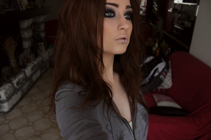 Niky Von Macabre with smoky eyes and piercings