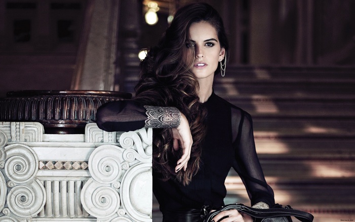 Izabel Goulart in a black outfit with bracelets