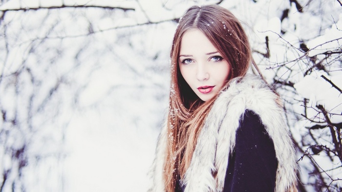 Woman with red lipstick in the snow