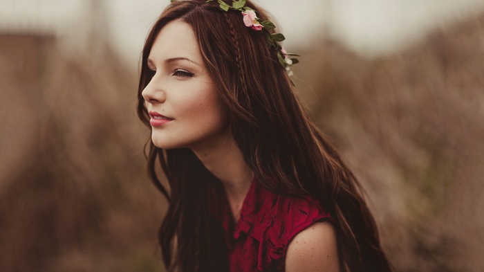 Woman with flower crown and red dress outdoors
