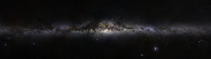 The Milky Way galaxy stretches across the dark sky