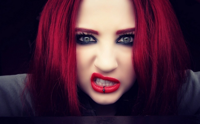Niky Von Macabre with red hair and lip ring