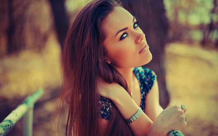 Brunette woman with makeup outdoors