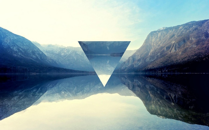 Geometric Triangle Over Mountain Lake Reflection
