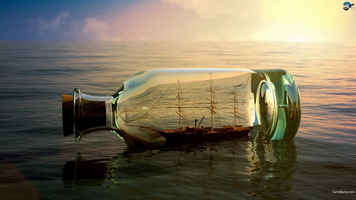 Ship in a bottle floating on the ocean at sunset