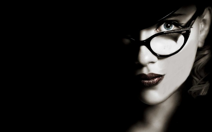 Scarlett Johansson wearing glasses in the dark