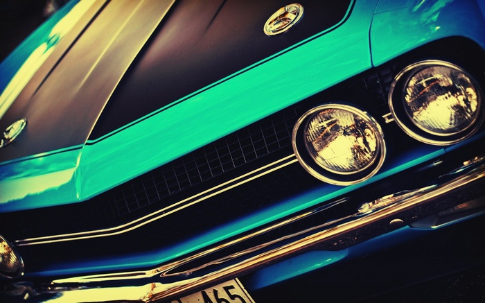 Close-up of a vintage teal Ford Torino front