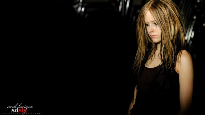 Avril Lavigne in dark tank top