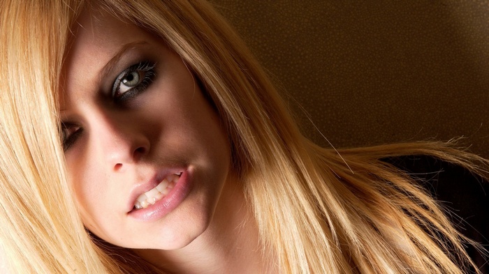 Avril Lavigne portrait with blonde hair and makeup