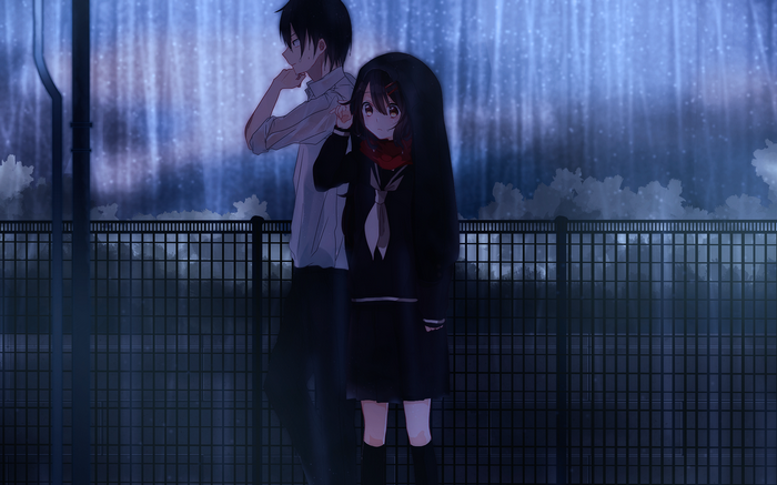 Couple standing in the rain