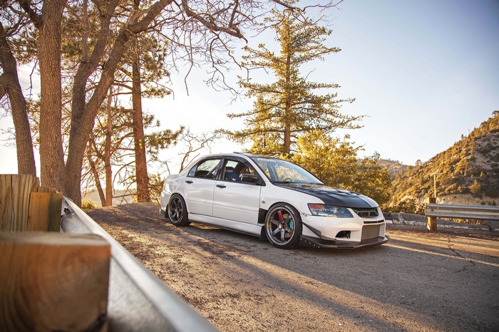 White Mitsubishi Lancer EVO with custom modifications